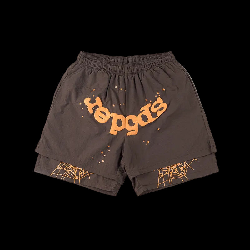 Brown shorts with orange text and spider web designs on a white background