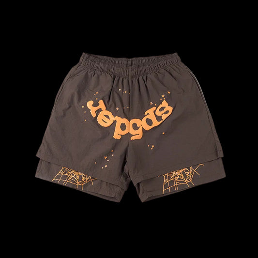 Brown shorts with orange text and spider web designs on a white background